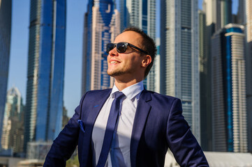 Successful yang businessman in yellow cabrio car.