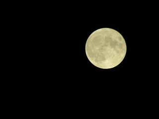 Fototapeta na wymiar full moon over black