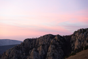 Fototapeta na wymiar Evening mountain landscape, sunset pink-purple sky of Demerdzhi