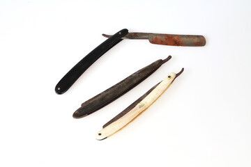 Lot of three old vintage dirty grunge blade razor accessories barbershop on white background, dirty tool with rust and grunge