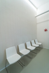 Eye clinic waiting room. White hospital clinic office waiting room. Eye surgery, eye clinic anteroom.