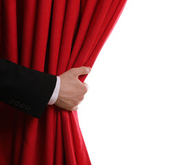 Man opening red front curtains on white background, closeup