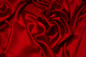 Rich and luxury red silk fabric texture background.