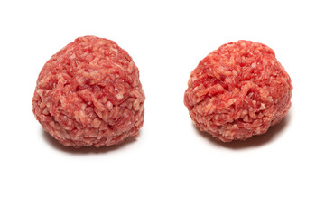 Raw meat balls isolated on white background.