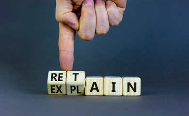 Retain or explain symbol. Businessman turns wooden cubes and changes the word explain to retain....