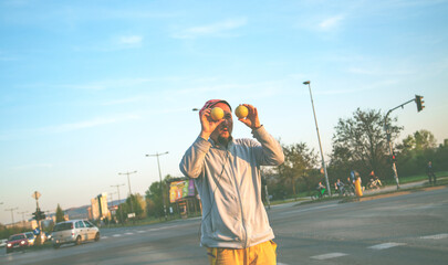 A juggler working in traffic. 
Juggler man performing at the traffic lights, after the presentation he asks the drivers for a donation.
