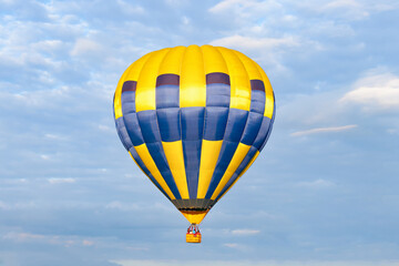Mongolfieria Balloon Festival, Yellow-blue bright, motley hot air balloon close-up in the air against the blue sky, backgrounds, wallpapers