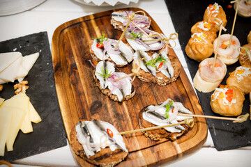 Delicious cooked sandwiches on a wooden tray