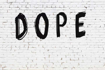 White wall with black paint inscription dope on it © iushakovsky