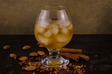 cognac with ice almonds cinnamon and amber