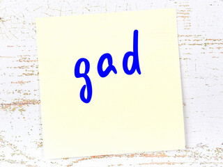 Yellow sheet of paper with word gad. Reminder concept © iushakovsky