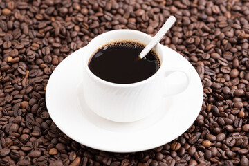 Coffee mug with spoon isolated