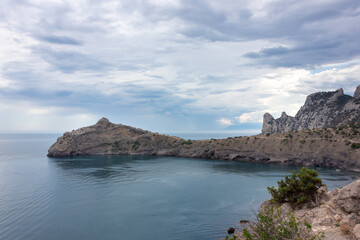 Fototapeta na wymiar Dolphin rock in the Crimea. A mountain jutting out into the sea.
