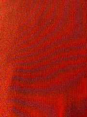 Bright orange material woven background