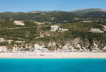 Fototapeta na wymiar Drone view of scenic beach with white sand and turquoise sea, Greek islands.