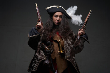 Caribbean female corsair wearing costume with guns