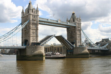 Fototapeta na wymiar Tower Bridge in London England Open to Let a Ship Pass on the Thames