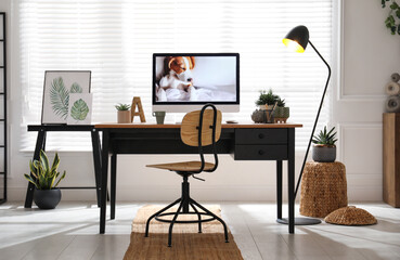 Stylish home office interior with comfortable workplace