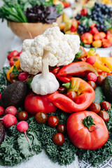 Mountain of vegetables on a lush dining table set for an event
