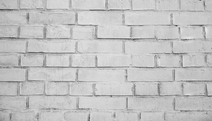 White brick wall background. Detail of a white brick wall texture. Grunge white brick backdrop. Surface of gray brick wall