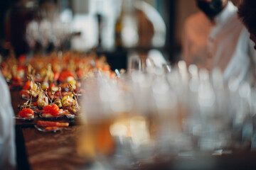 Food catering appetizers snacks on a tray on table.