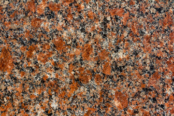 Texture photo of red toned marble stone pattern close-up view.