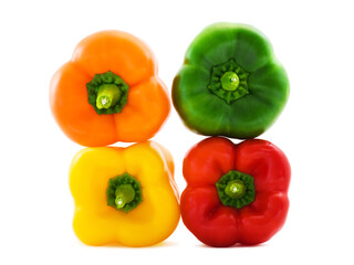 Orange, green, red and yellow bell peppers (paprika)