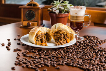 Delicious Classic Meat Sandwich Bakery with a Beautiful Coffee over a wooden table