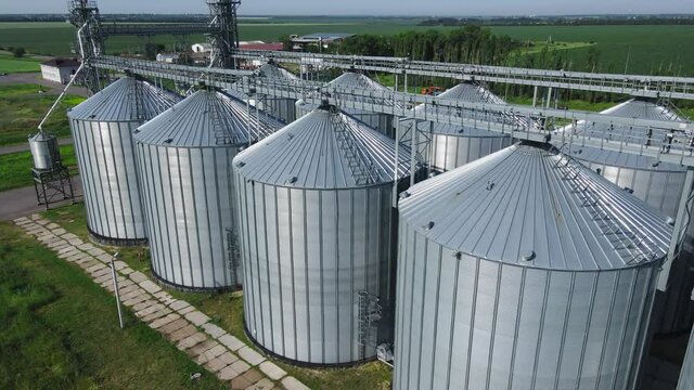 Aerial view of Plant for storage and processing of grain, silo system tanks, grain bin and elevator
