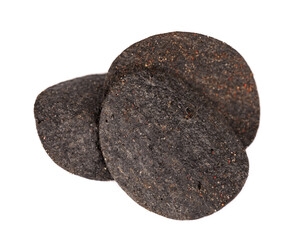 Black potato chips isolated on white background. Black chips with activated charcoal and red pepper.