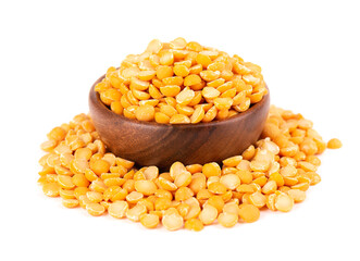 Dry yellow split peas in wooden bowl, isolated on white background. Halves of yellow legume peas.