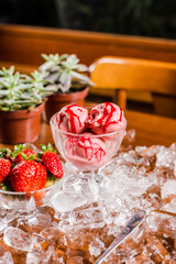 Perfect Strawberry Ice Cream on a Wooden Tablet Covered of Ice Cubes Refreshing Food Dessert
