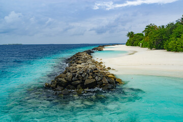 the sandy coast of a coral island in the Indian Ocean