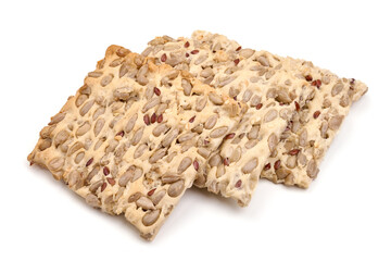 Stack of wholegrain crispy bread with sunflower, linen and sesames seeds, isolated on white background. High resolution image.