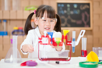 young girl plays  science experiment for home schooling