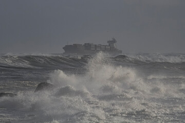 Naklejka na ściany i meble Container ship on a stormy day
