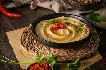 Delicious hummus in ceramic bowl