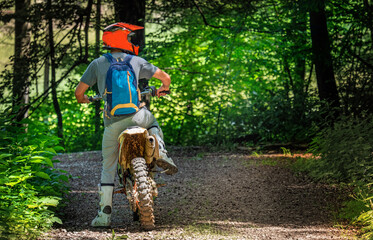 motorcyclist on the enduro route, rear view