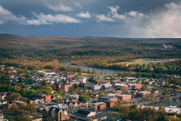 Fototapeta na wymiar A city with a river running through it, - view of Port Jervis, New York from Elks-Brox Memorial Park