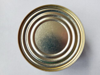 Metal tin can top view on a gray background