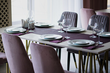 Table setting in the restaurant. Preparing the restaurant for the opening.
