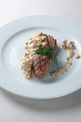 Menu for the restaurant: beef medallions with mushroom sauce.