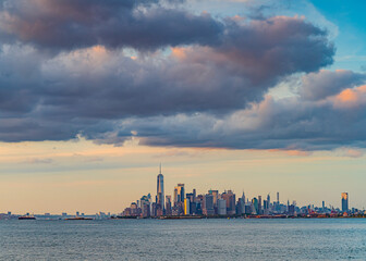 Beautiful waterfront, sky and clouds during sunset, view on Gravesend Bay in Brooklyn and...