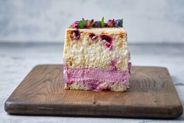 A cutaway berry sponge cake. Cake with cream cheese mousse, condensed milk and blackberry puree....