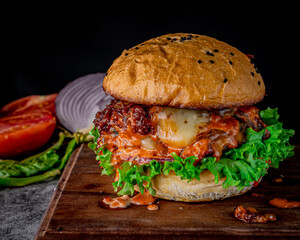 Delicious classic hamburger with bacon and dressing