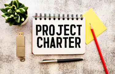Project Charter text on blackboard, business concept background
