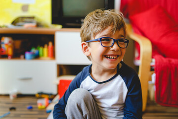 happy small caucasian boy four years old smiling at home - Powered by Adobe