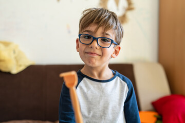 happy small caucasian boy four years old smiling at home looking to the camera