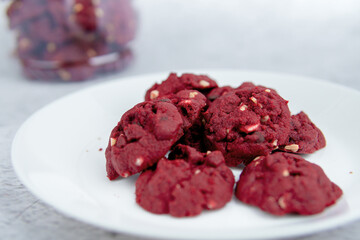 Red velvet cookies with background decoration. Selective focus.