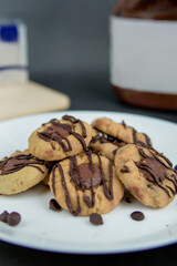 Chocolate thumbprint cookies with background decoration. Selective focus.
